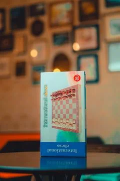 International chess set box displayed in a cafe Фото