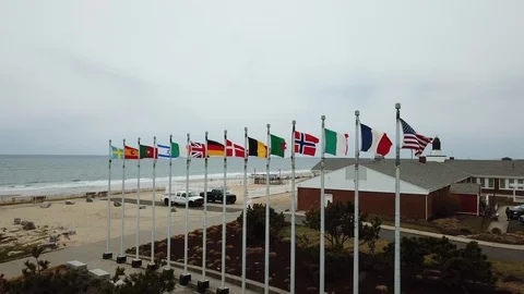 International flags blowing in wind Flight 800 memorial Stock Footage 106040811