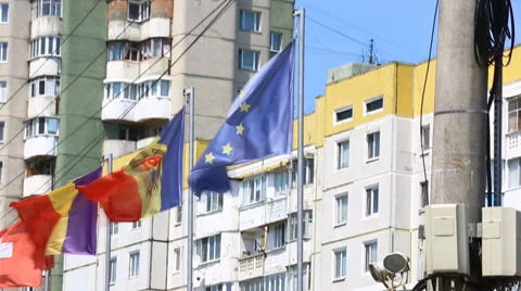 International flags of several countries waving in the wind on the balcony of a  Stock Footage 64880904