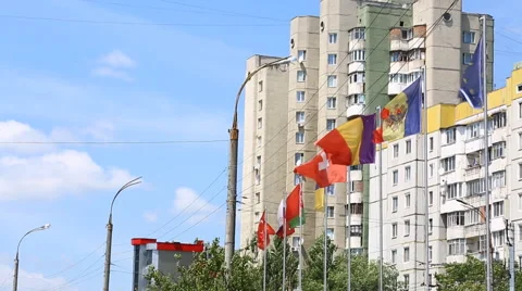 International flags of several countries waving in the wind on the balcony of a  Video stock 64881095