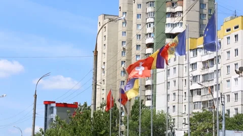 International flags of several countries waving in the wind on the balcony of a  Video stock 64881391