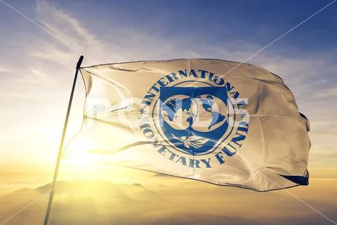 International Monetary Fund IMF flag waving on the top sunrise mist fog Stock Photos