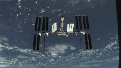 International Space Station Orbiting Earth shot from above Stock Footage