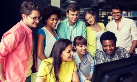 International students with computers at library Stock Photos