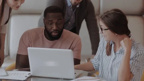 International students happy with the results. checking lap top Stock Footage 86953353