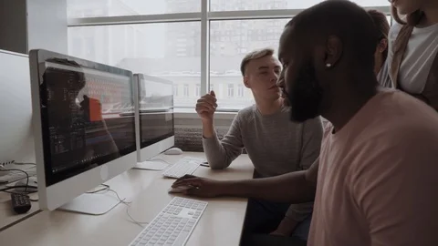 International team is working on a project through the visual studio. Stock Footage 86572730