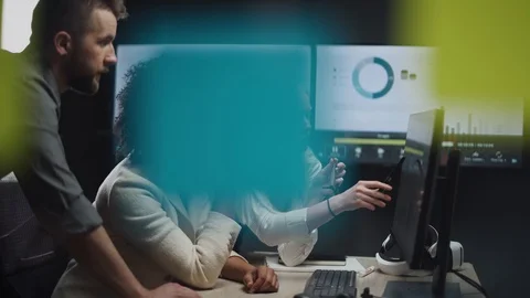 International teamwork in modern office, man and two women managers look Stock Footage