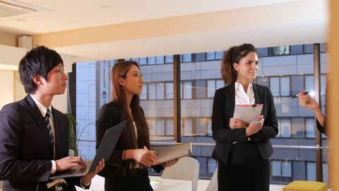 Internatiopnal team working on project at the office  Stock Footage 80808297