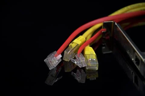 Internet Access. Wires for internet connection on a black background. Reflect Stock Photos