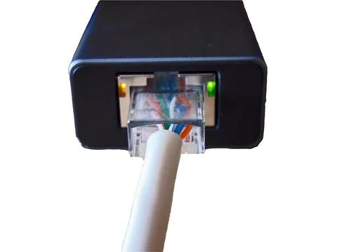 Internet cable in an adapter Fotos de archivo
