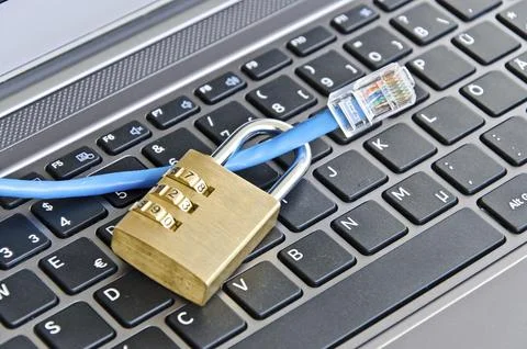 Internet cable and padlock on computer keyboard symbolizing data security 스톡 사진