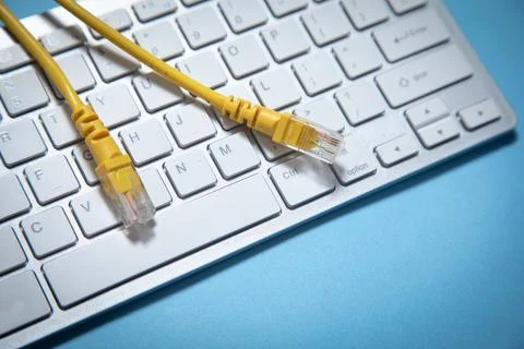 Internet cable on computer keyboard. Internet. Technology Stock Photos