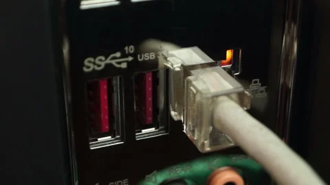 Internet cable connected to computer port with flashing light Stock Footage 104644663