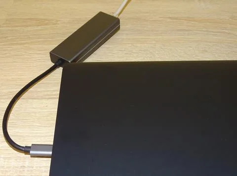 Internet cable connected to a multi-functional USB-C Hub station, Ethernet,.. Foto stock