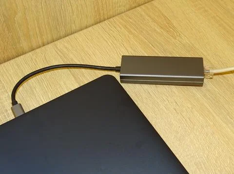 Internet cable connected to a multi-functional USB-C Hub station, Ethernet,.. Photos