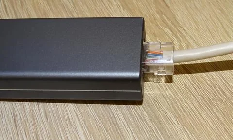 Internet cable connected to a multi-functional USB-C Hub station, Ethernet 스톡 사진