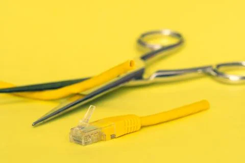 Internet cable cut by scissors Stock Photos