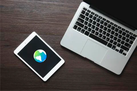 Internet communication globe in the device screen 写真素材