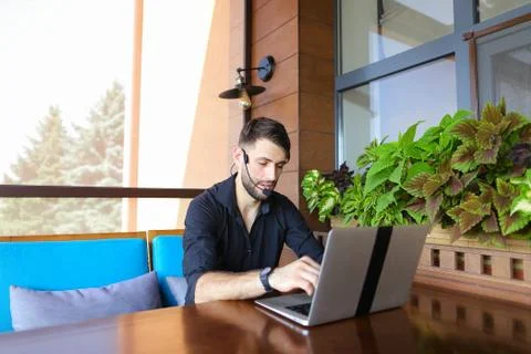 Internet consultant talking to client with web camera and microp 스톡 사진