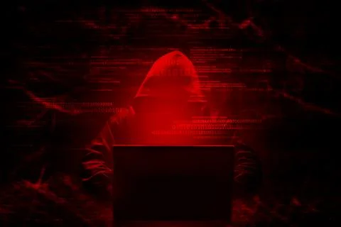 Internet crime concept. Hacker working on a code on dark digital background.. Stock Photos