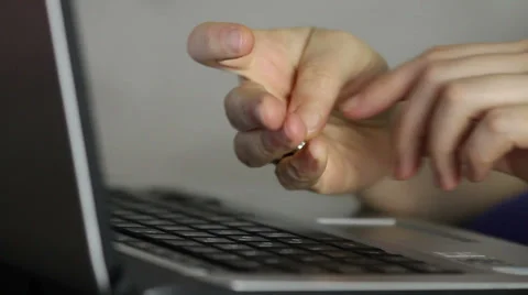 Internet - Data security, Hand typing, putting a small lock on keypad Stock Footage 34632255