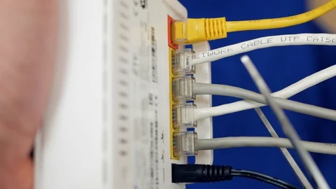 Internet disconnect. Wireless router. Hand cuts off internet cables. Closeup Vídeos de archivo 102647203