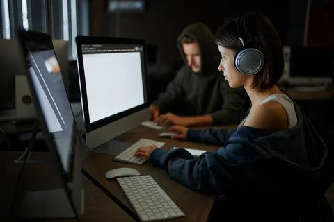Internet hackers works on computers, teamwork Stock Photos