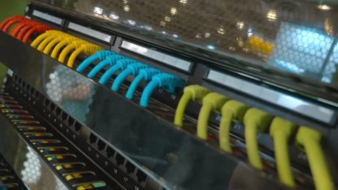 The internet hub has multiple sockets with wires of different colors connected  Stock Footage 333327764