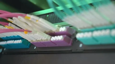 The internet hub has multiple sockets with wires of different colors connected  Stock Footage 333348691