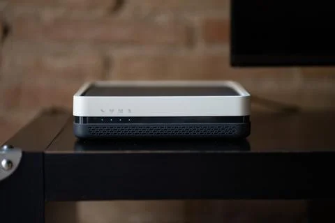 Internet modern wireless router on a dark wooden table Stock Photos
