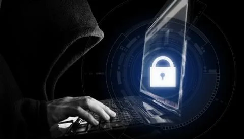 Internet network security system. Hacker in black hoodie using computer laptop Stock Photos