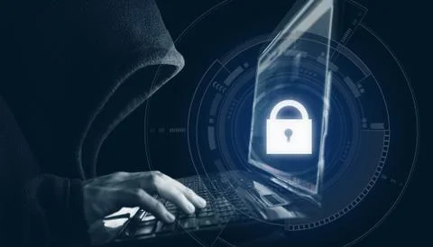 Internet network security system. Hacker in black hoodie using computer laptop Stock Photos