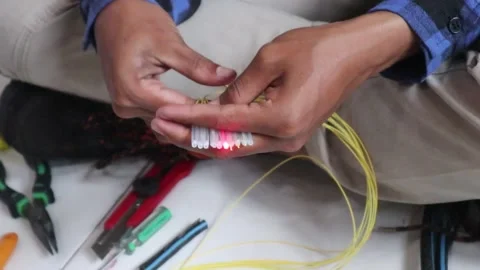 Internet network technicians maintain fiber optic cables 動画素材 343328975