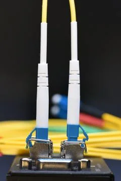 Internet network technology, fiber optic cable connected to switch Stock Photos