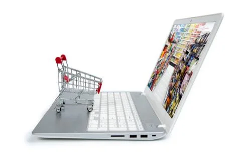 Internet online shopping concept with computer and cart Stock Photos