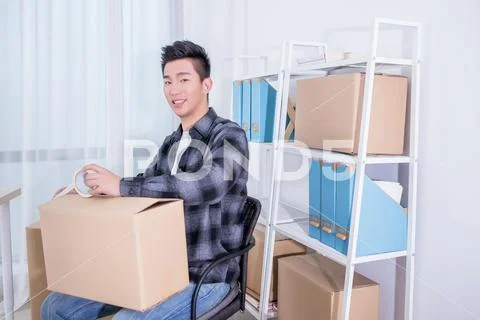 Internet online shopping concept, Young seller man working in office Stock Photos