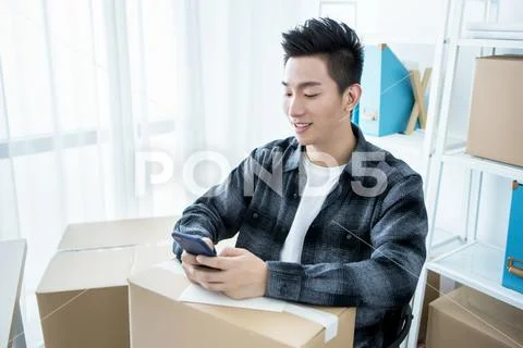 Internet online shopping concept, Young seller man working in office Stock Photos