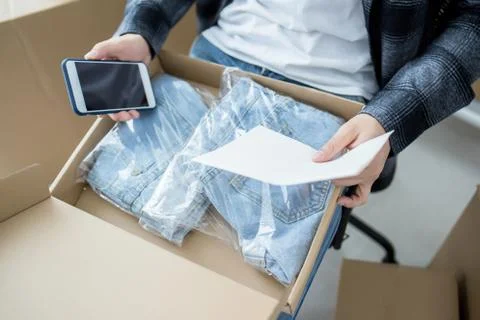 Internet online shopping concept, Young seller man preparing package Stock Photos
