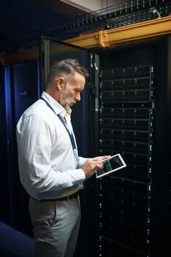 Internet, programming and man in workplace, tablet for software development.. Stock Photos