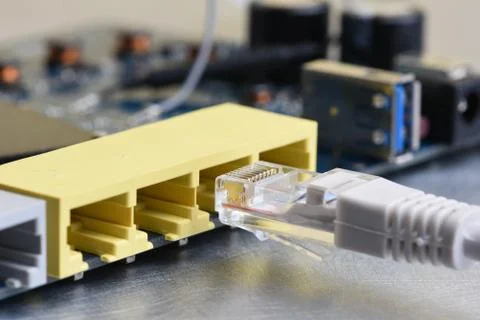 Internet router port with network patch cord Stock Photos