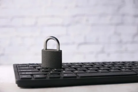 Internet safety concept with padlocked on computer keyboard Stock Photos