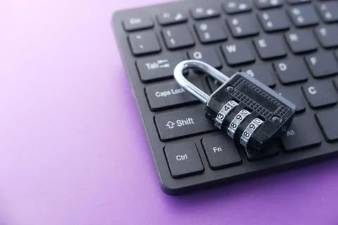 Internet safety concept with padlocked on computer keyboard Stock Photos