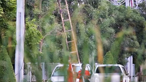Internet technician using ladder to climb electrical pole to install equipment Stock-Footage 113383074