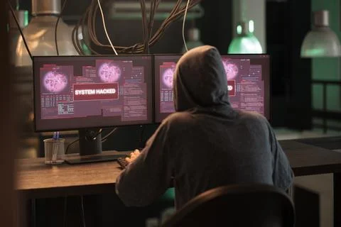 Internet thief creating security breach and hacking computer system Stock Photos
