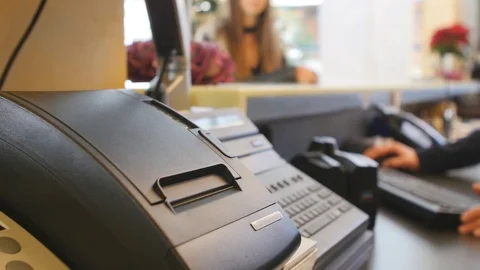Internet ticket being printed at hotel front desk issuing Video stock 78087418