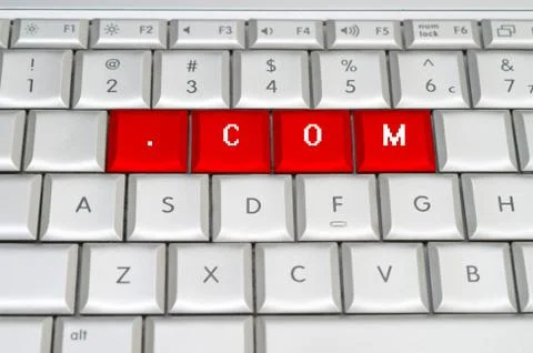 Internet top level domain .com spelled on metallic keyboard Illustration