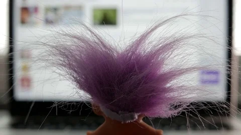 Internet Troll with pink hair is online, checking a social media account Stock Footage