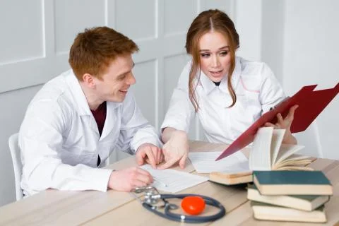 Interns have a rest in the internship during a short break and rejoice Stock Photos