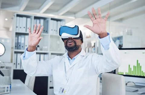 Interpreting data in many different ways. a mature scientist using a virtual Stock Photos