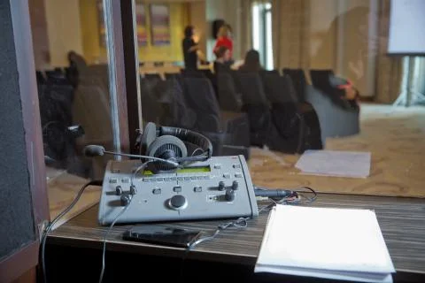 Interpreting - Microphone and switchboard in an simultaneous interpreter boot Stock Photos